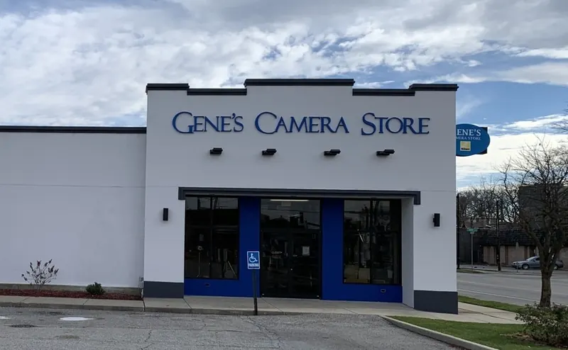 A white building featuring a sign that reads 
