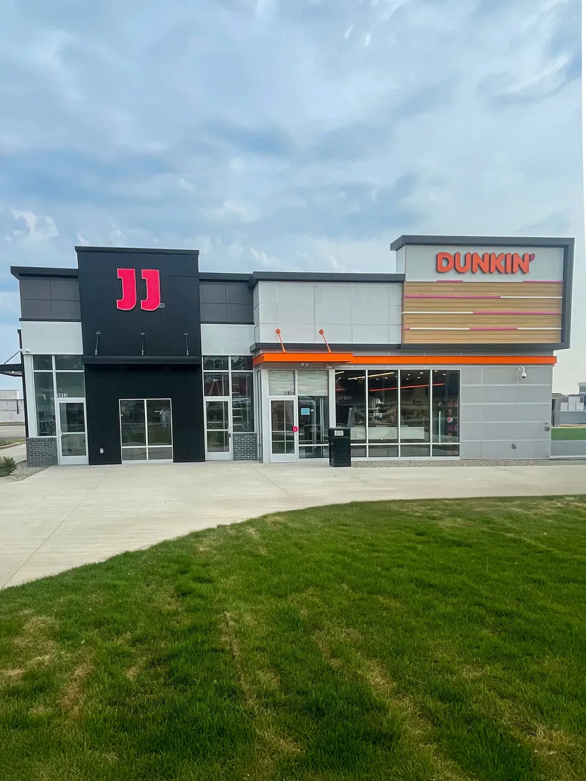 A side-by-side commercial building featuring a black 