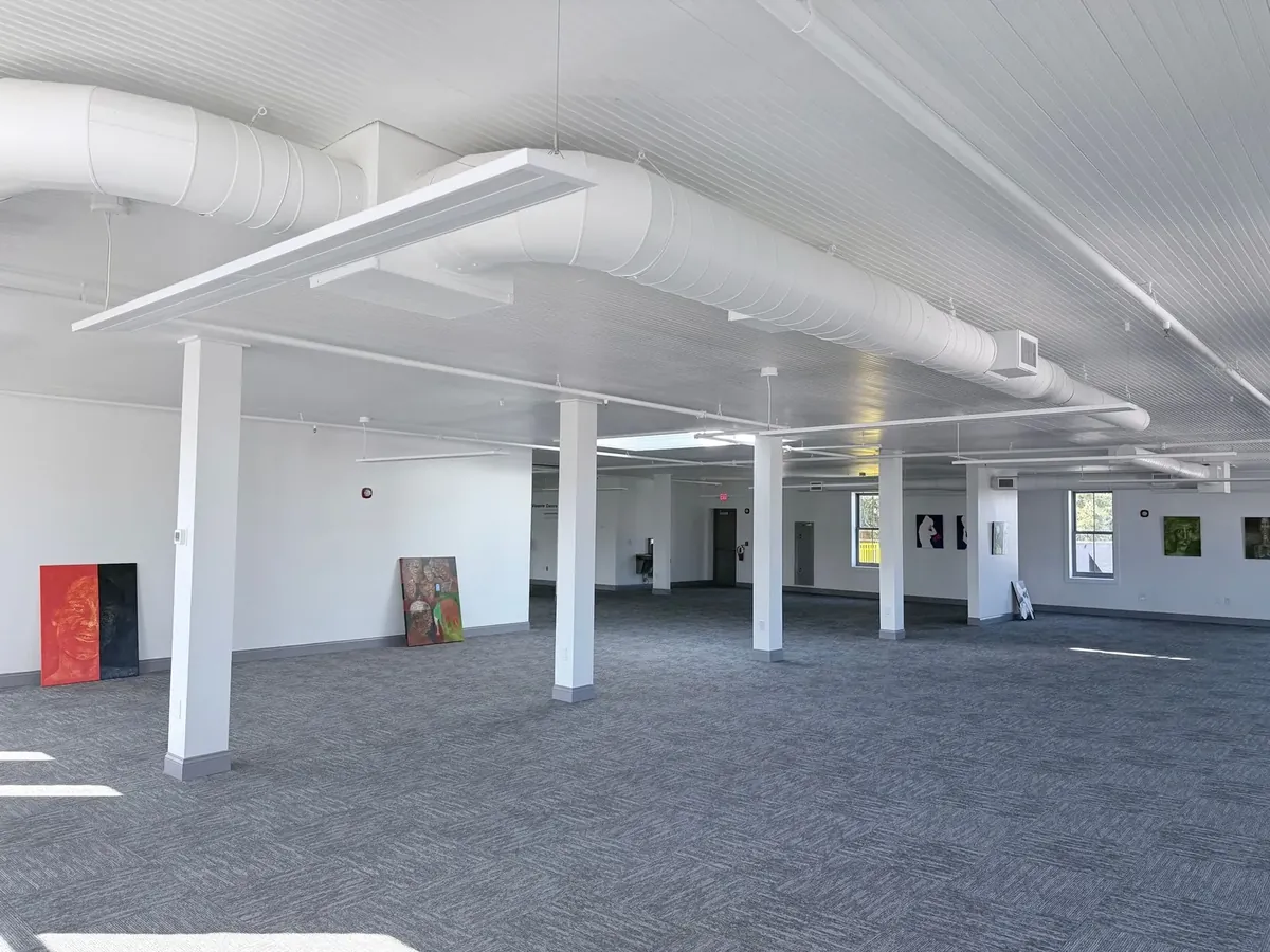 Commercial interior painting in Ybor City Tampa with white walls and exposed ductwork